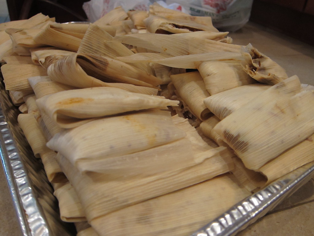 A large tray of homemade tamales, ready for pickup or delivery